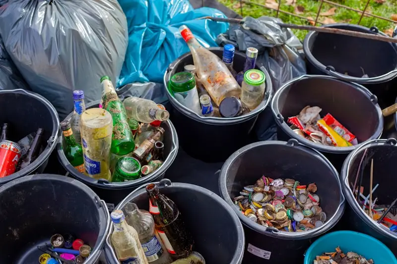 Sorted bottles and recyclables collected at a community cleanup event